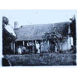 Early settler and family outside home, Casino