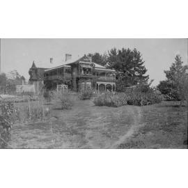 Saumarez Homestead, covered with vines, tennis courts