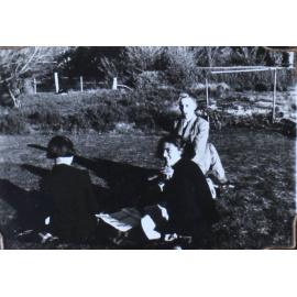 NEUC students sitting on the lawn