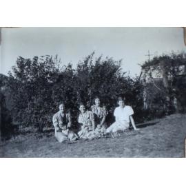 Four female students sitting on the lawn