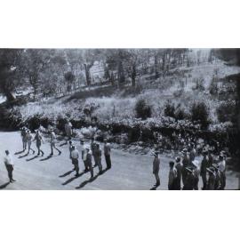 NEUC staff and students drill outside Booloominbah, 1941