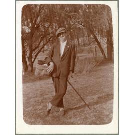 Man with walking cane and picnic basket