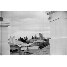 View across rooftops to cathedrals from Post Office roof, 1950s