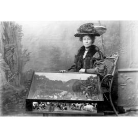 Mrs Mary Jane Penrose-Johnston with her farm animal models, 1899