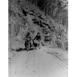 Two men with motorbike and sidecar on Kempsey Road, 1930