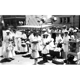 Ladies and girls at a fair outside the Court House, c.1915