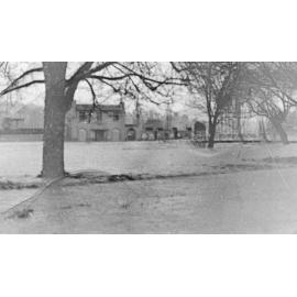 Big flood and snow, looking across creek towards City Baths complex, Armidale