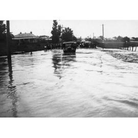 Flood across street at northern end of new bridge in Marsh Street, looking towards North Armidale, 19 February 1928