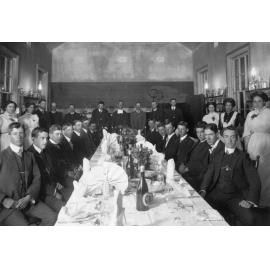 Students of De La Salle Boys' College at a formal dinner held in the Science Room 