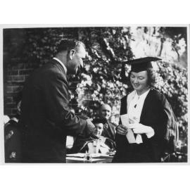 Mr D H Drummond, making presentation to a student at graduation