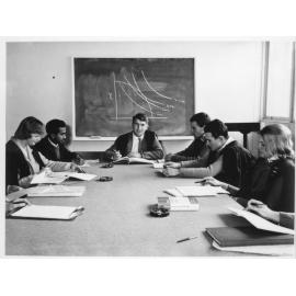 Tutorial group around table with Prof. Warren Musgrave