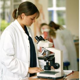 Student with microscope, UNE, 1999