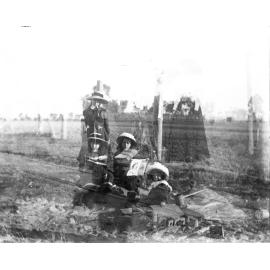 Double exposed, children in hats and railway tracks
