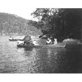 People in canoes on a lake