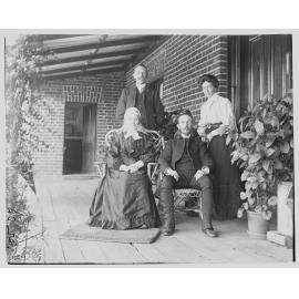 Group portrait of two men and two women on a verandah, 1907