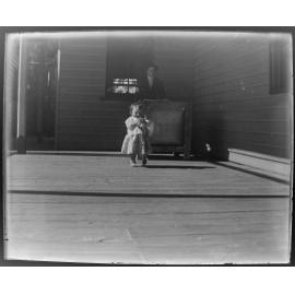 Woman and child on a verandah