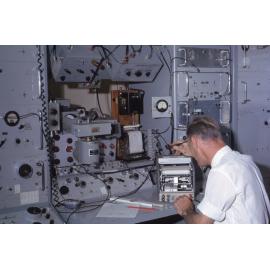 Man using scientific instrumentation for radio research, UNE