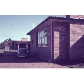 External view of Wright College with a car, UNE