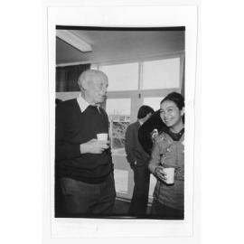 Two unidentified individuals at a gathering, UNE
