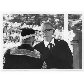 Sir Frank Kitto (left) conferring honorary degree on Cam Howard