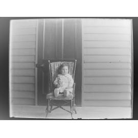 A boy sitting in a chair