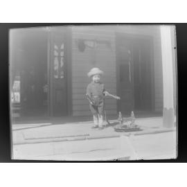 Boy playing on the front porch