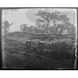 Maggie and Georgie in bed of River Walla, 1906