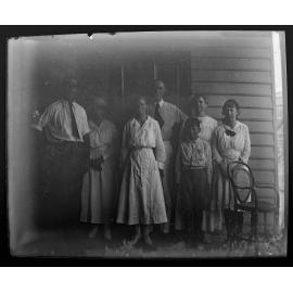Group photo of two men, four women and a boy