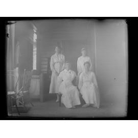 Posed group portrait of four women
