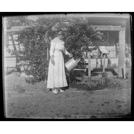 Woman watering a garden