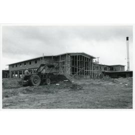 Wright College under construction with tractor, 1960