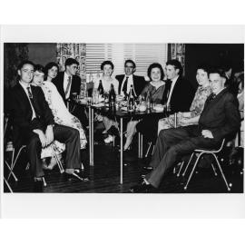 Wright College party, group seated at a table