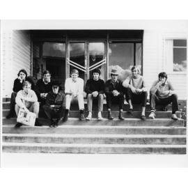 Wright College students sitting on outside steps