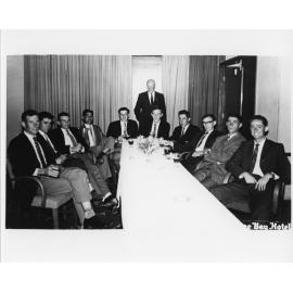 Wright College - Group of gentlemen around a table