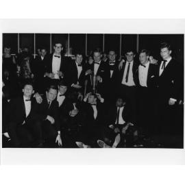 Wright College party group with trophy
