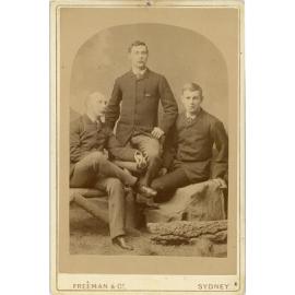 Three men (father and sons?)