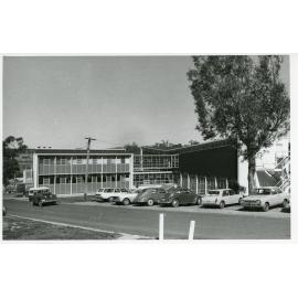 Cars parked in front of the Rural Science building, UNE