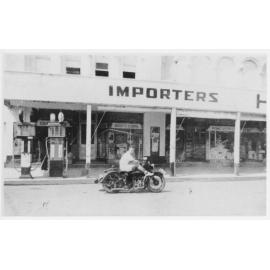 Trevor Jack on his motorbike out the front of Hong Yuen, Inverell, c1935