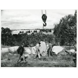U.N.E. Bronze plaque rock lift