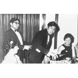 Pouring champagne at an unidentified Wright College event