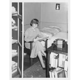 Student reading a Nucleus magazine in a dormitory