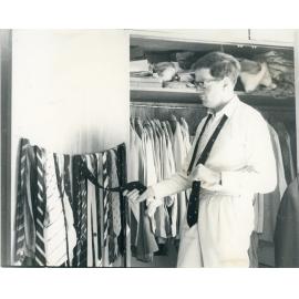 John Ryan looking at ties