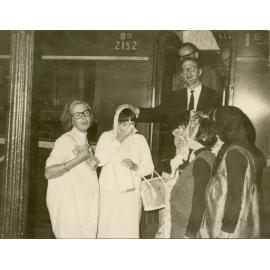 Wright College students performing a farewell scene at a train, with John Ryan in the carriage doorway
