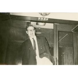 John Ryan inside train carriage, [Wright College] 1964