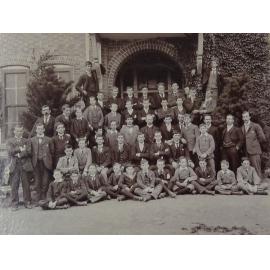 Group of pupils and staff outside the Armidale School