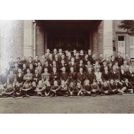 Group of pupils and staff outside the Armidale School