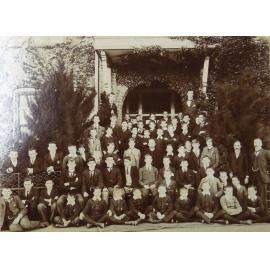 Group of pupils and staff outside the Armidale School