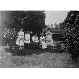 Women and children in a garden