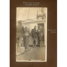 Helmsman keeping his feet warm, showing Cherry and Drake