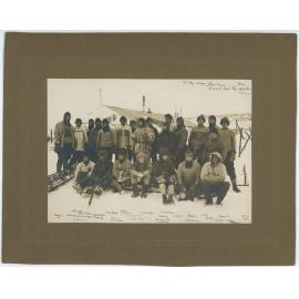 Expedition members outside the hut at Cape Evans